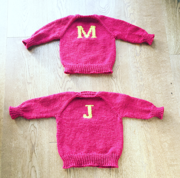 Two red hand-knitted Weasley jumpers