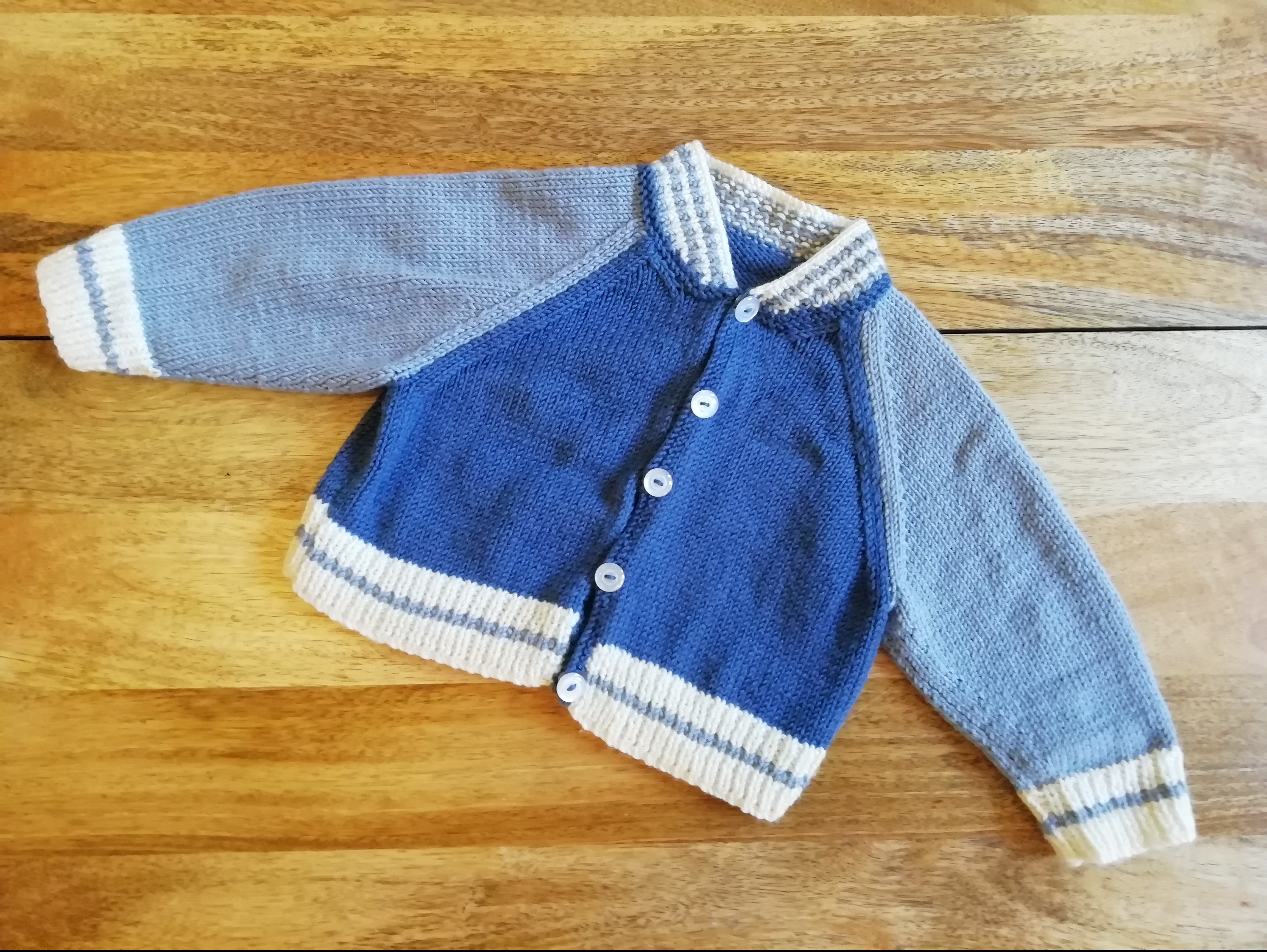 Baby Baseball Jacket knitted in Denim, Mist and Ecru